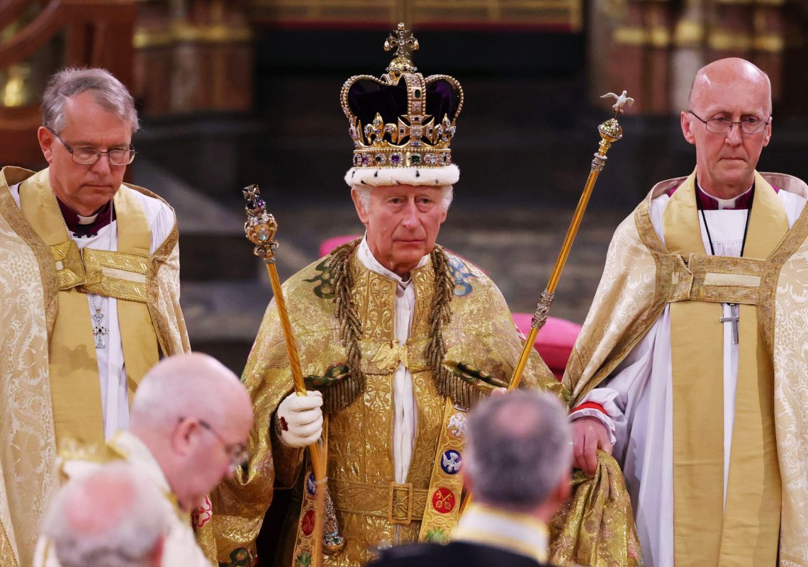 LONDON, ENGLAND - MAY 06:  King Charles III stands after being crowned during his coronation ceremony in Westminster Abbey, on May 6, 2023 in London, England. The Coronation of Charles III and his wife, Camilla, as King and Queen of the United Kingdom of Great Britain and Northern Ireland, and the other Commonwealth realms takes place at Westminster Abbey today. Charles acceded to the throne on 8 September 2022, upon the death of his mother, Elizabeth II. (Photo by Richard Pohle - WPA Pool/Getty Images)